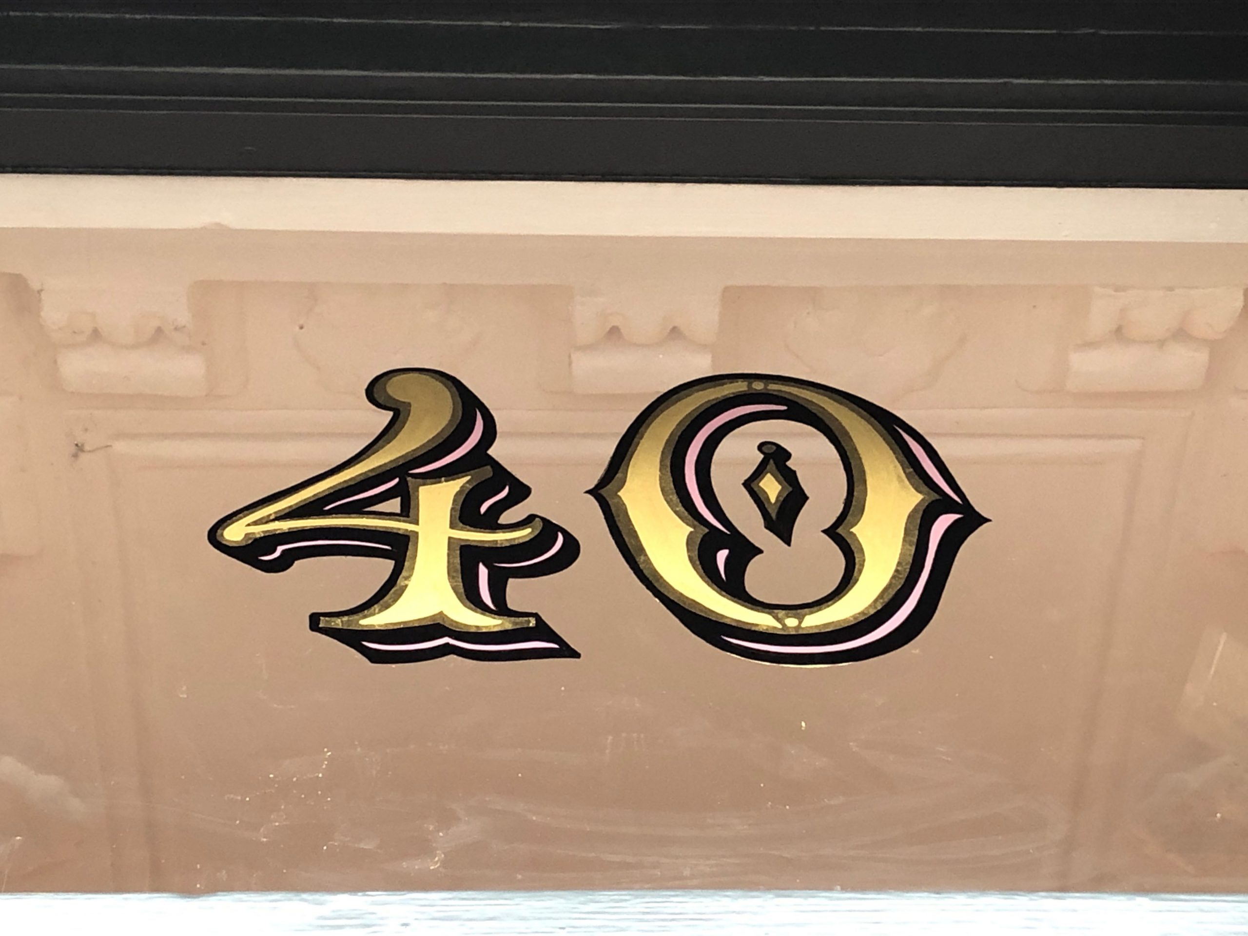 Gilded Xmas sign panel for Sothebys London.

Gold Transom signs, Sign Writing Motcomb Walton Street, art gallery roman lettering signage by Seraina Signs London.