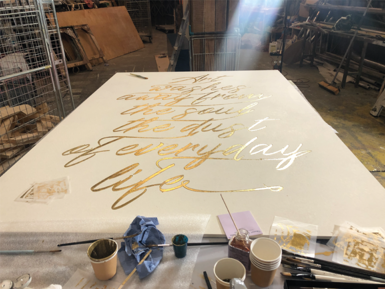 Gilded Xmas sign panel for Sothebys London.

Gold Transom signs, Sign Writing Motcomb Walton Street, art gallery roman lettering signage by Seraina Signs London.