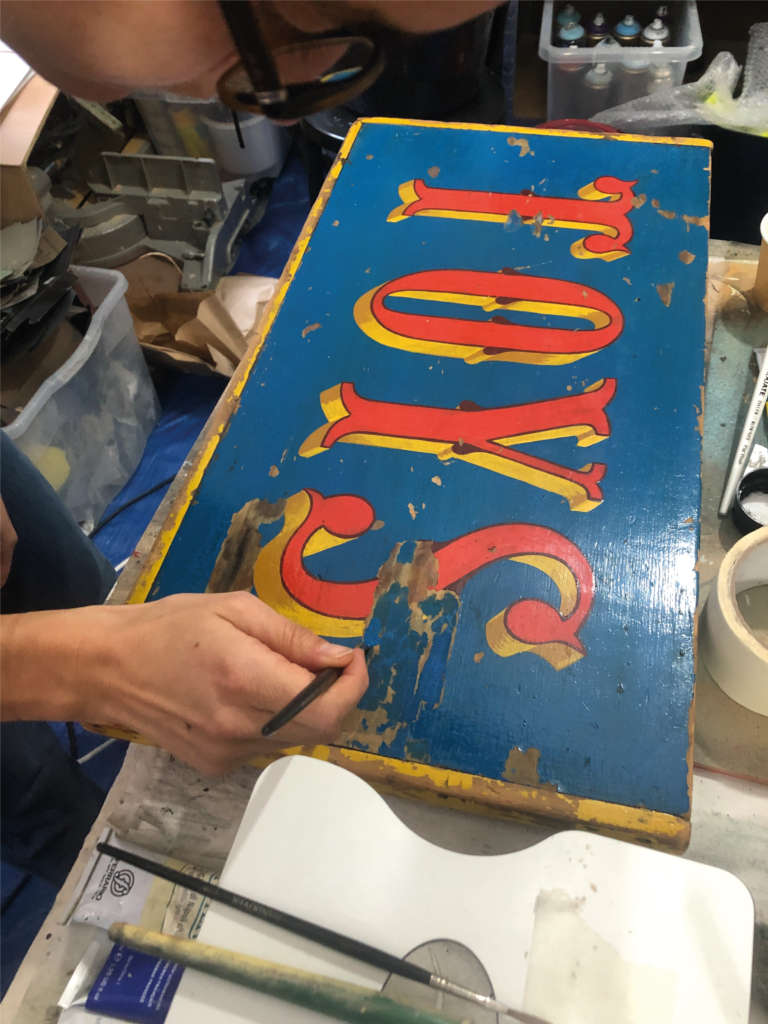 Restoration sign writing.
, toybox restored,  Sign writing all London
