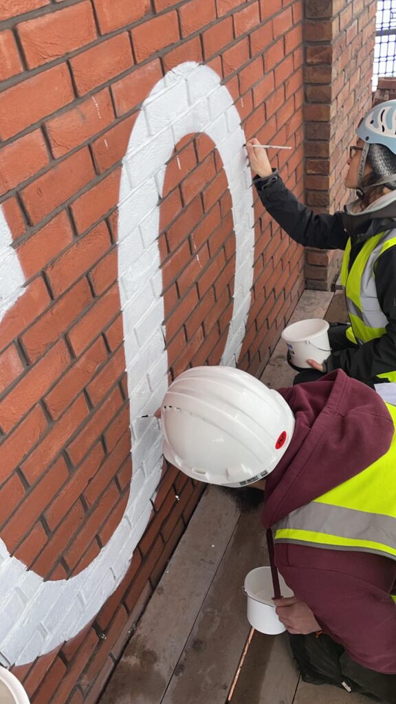 London traditional signwriting, Sign writers near me, signwriting near me, signage companies near me, london signs, signwriting kent, sign makers uk, house builder sign, , Wall art for offices hand painted graphics Seraina London Mural painter