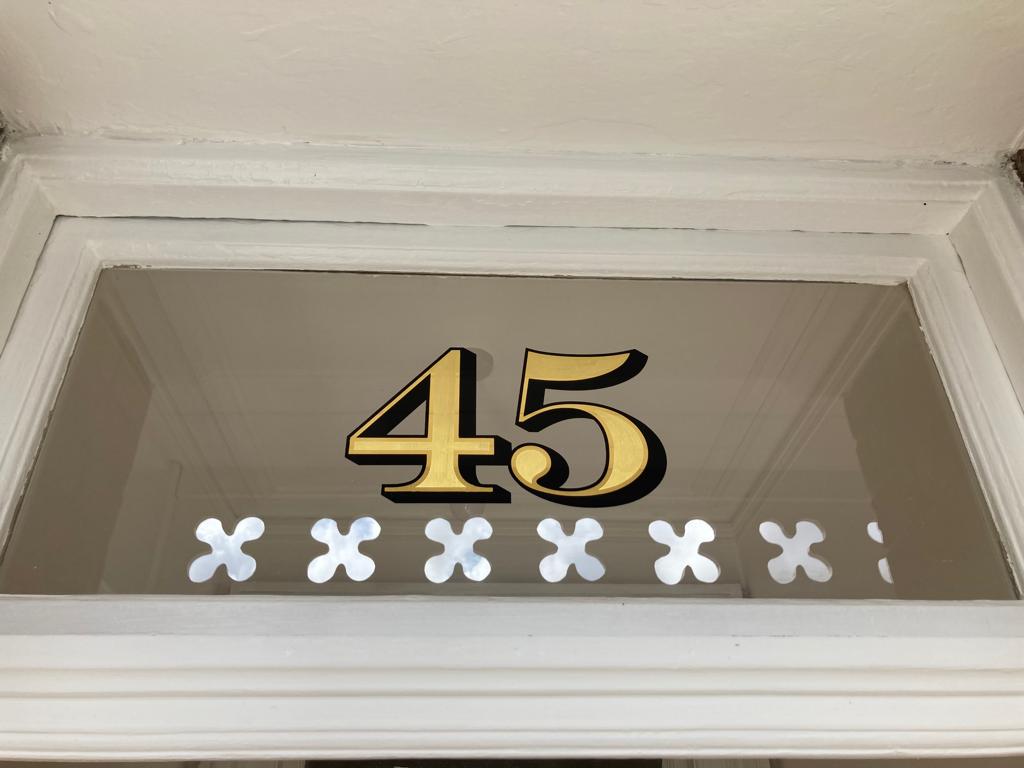Gold Leafed Transom house numbers, street numbers sign written