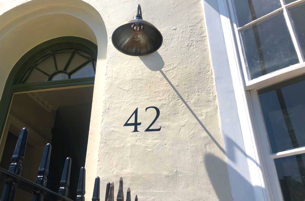 Traditional House numbers on stucco walls, Stone or Stucco: House Numbers , street numbers sign written, Vegan sign writing Woman, Girl sign writer, Gluten Free signs. Healthy house number design, vegan designer. Vegan sign writing Woman,