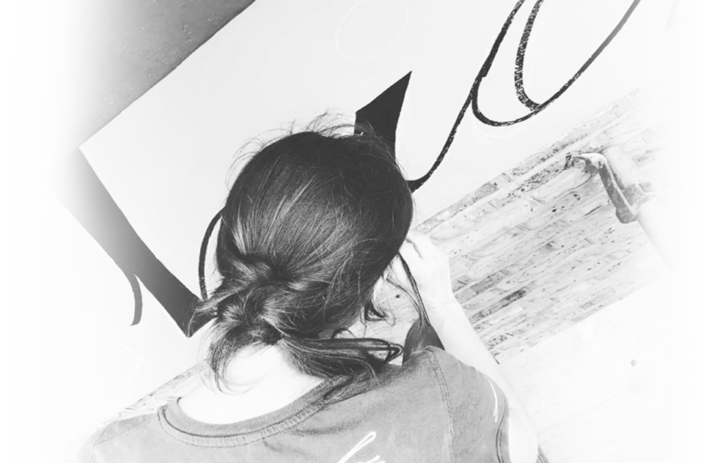 Women sign writer Seraina, London's best newcomer sign writer. Design sign studio London. LDN IOAFS. Rising star female sign painter.