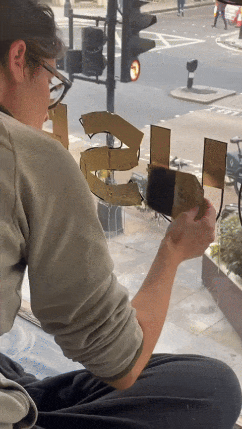 Seraina Gilding Canberra House Seraina Gilding lettering on glass at Canberra House Central London sign gilder. Gold leaf lettering.