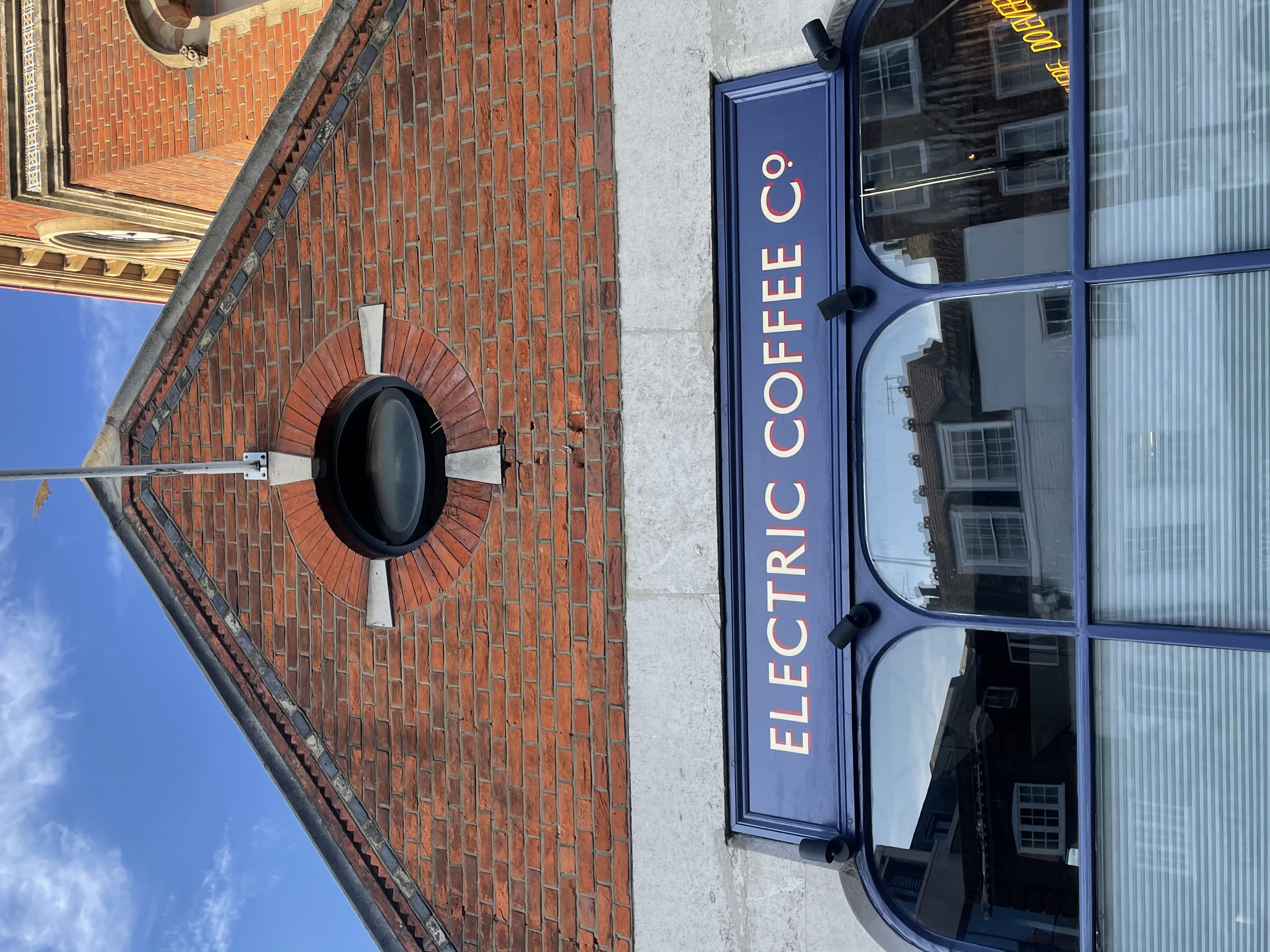 Seraina Sign writers near us, Richmond, west end London, Central London, Gold shop sign letters. Electric coffee co signwriter Seraina