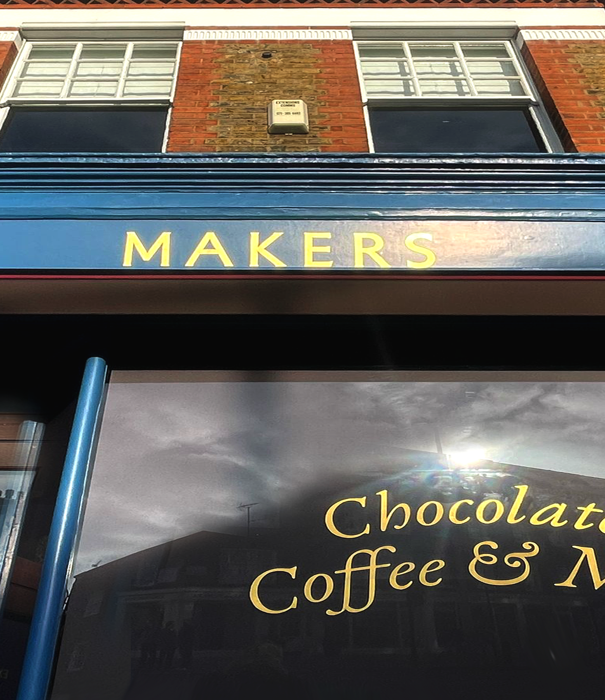 Traditional sign writer Seriana, LOndon sign painting shops cafes.