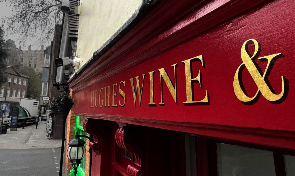 Hughes wine store sign written by Seraina signs Gold leaf specialisation. Bodoni.